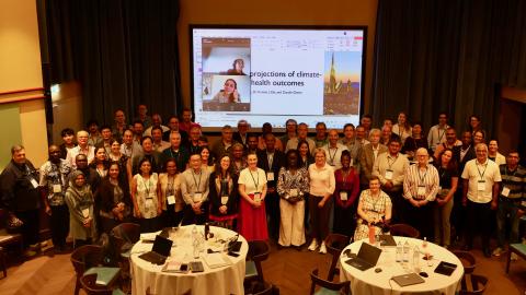 Group of people posing and smiling for the camera